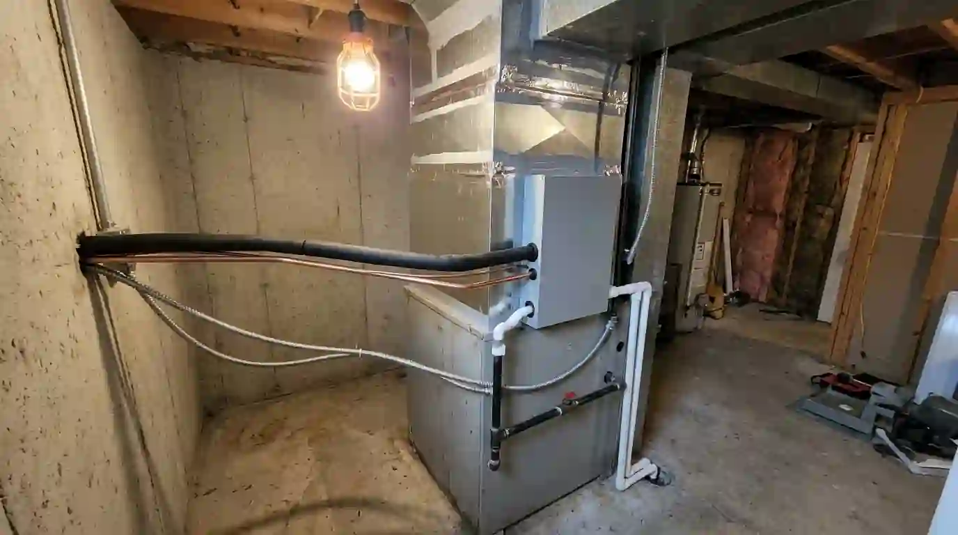Gas furnace with a new heat pump coil on top